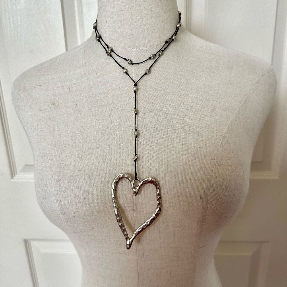 Silver tone long open heart necklace